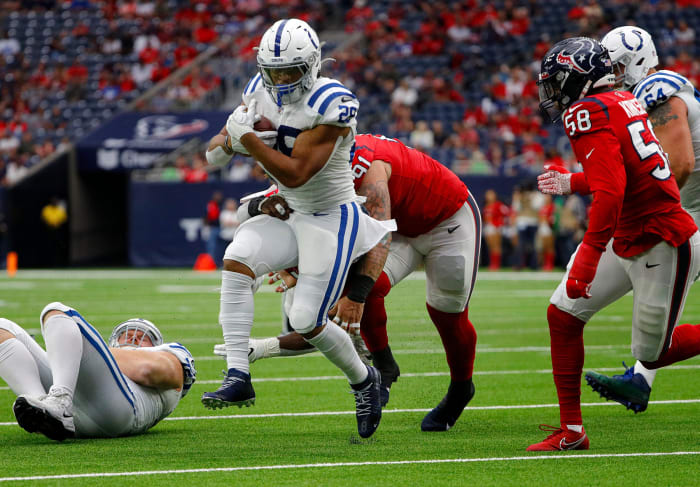 Indianapolis Colts running back Jonathan Taylor (28) runs the ball during the first quarter of the game Sunday, Dec. 5, 2021, at NRG Stadium in Houston. Indianapolis Colts Versus Houston Texans On Sunday Dec 5 2021 At Nrg Stadium In Houston Texas